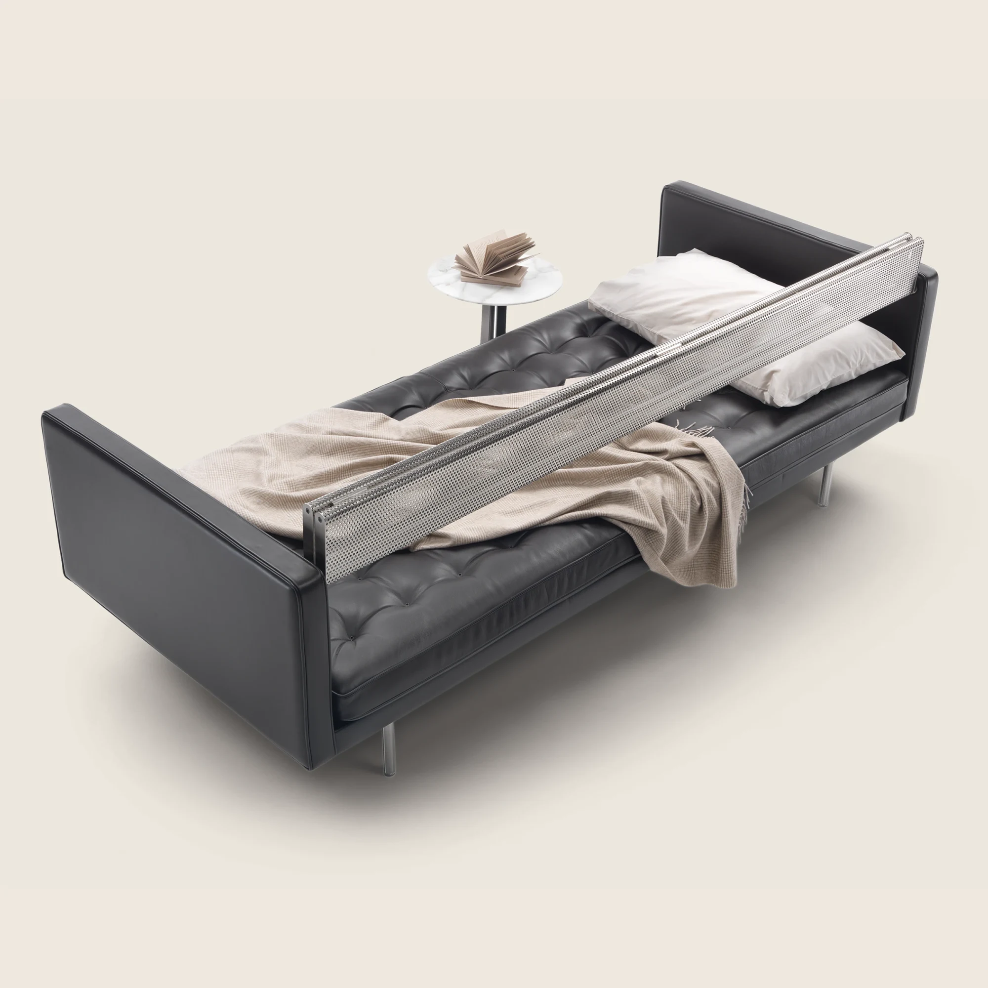 Magister sofa open as a daybed with a blanket on the shelf