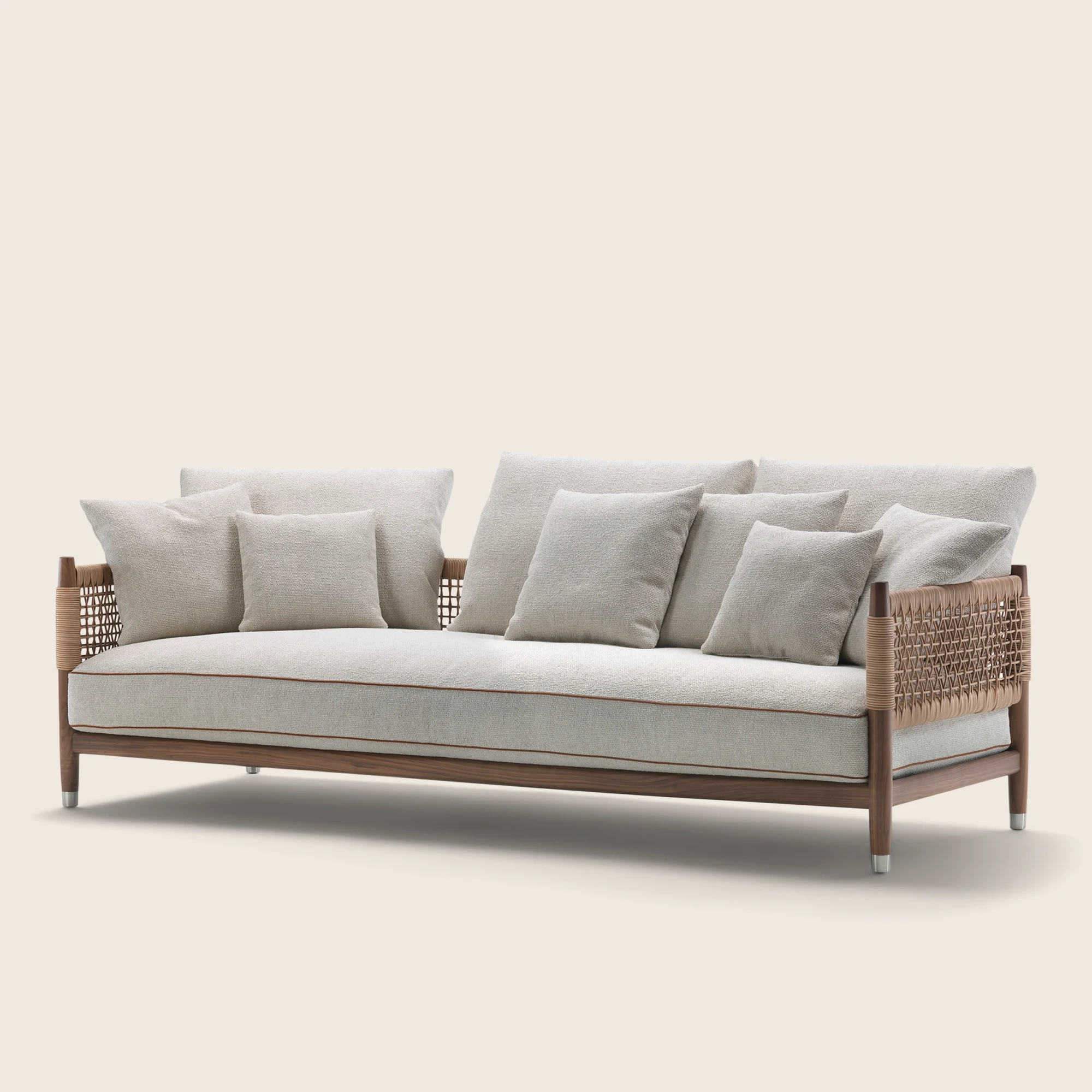 Three-quarter view of the Parker sofa with loose cushions, plain background